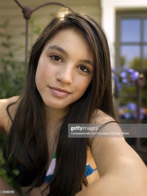 Portrait Of Browneyed Girl With Long Dark Hair High Res