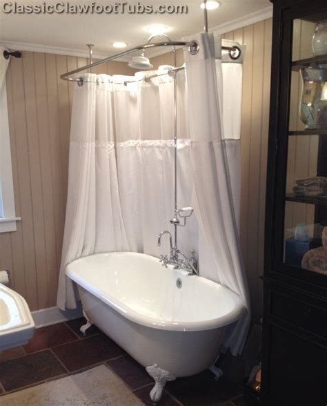 1922 vintage cast iron claw foot bathtub pulled out of a house in bloor west village under renovation, including brass faucet, brass supply lines, and brass overflow / drain. cast iron bathtub shower enclosure | truly visually ...