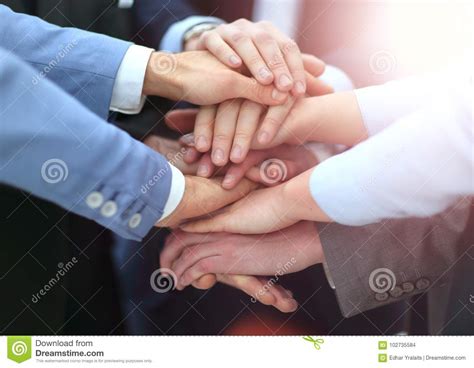 Creative Team Putting Their Hands Together In Circle Stock Photo