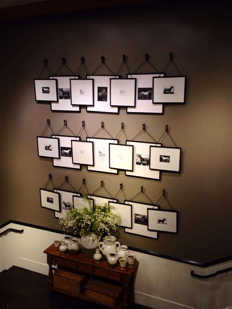 Overlapping picture frames hanging from hooks - Pottery Barn | House ...
