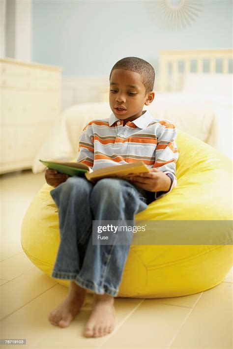 Little Boy Reading A Book High Res Stock Photo Getty Images