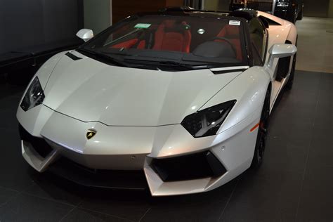Black and white is an american slang term for a police car that is painted in large panels of black and white, or generally any marked police car. This is a Lamborghini Aventador roadster with a pearl ...