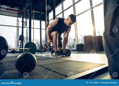 The Male Athlete Training Hard In The Gym Fitness And Healthy Life