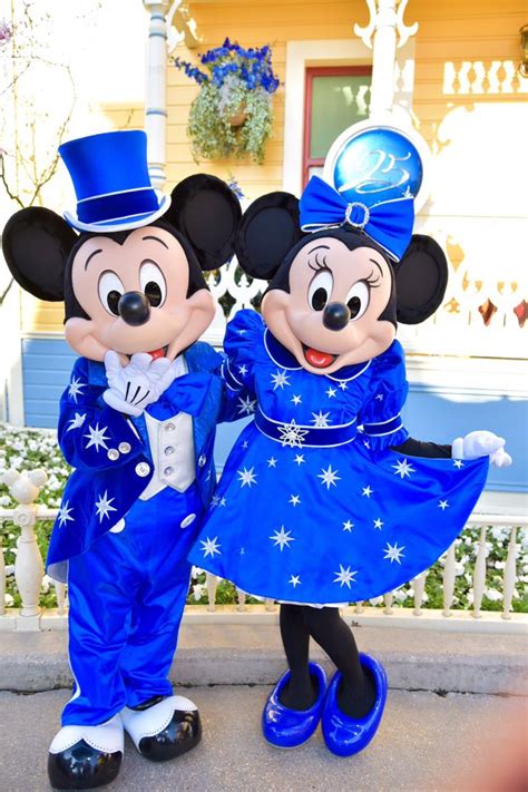 Mickey And Minnie Striking A Sweet Pose During The 25th Anniversary