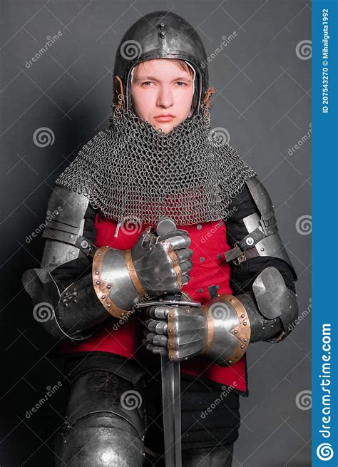 A Young Knight In Medieval Armor With A Weapon In His Hands Kneeled Stock Image Cartoondealer