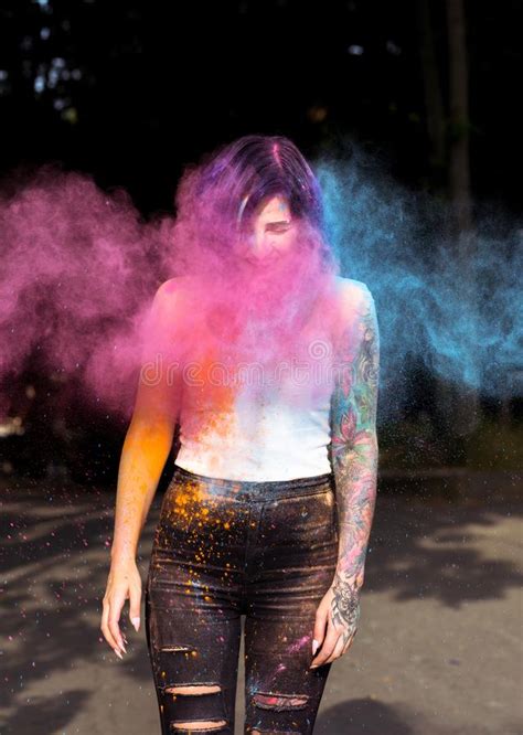 Brunette Tattooed Woman Posing With Blowing Holi Powder At The P Stock