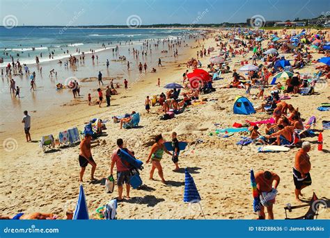 Crowded Beach And People In The Sea Waves Editorial Image