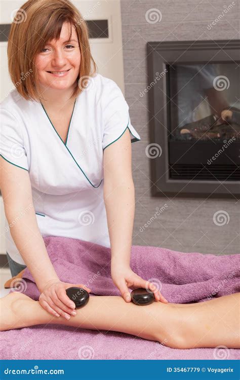 Beauty Salon Woman Getting Spa Hot Stone Legs Massage Stock Image Image Of Wellness
