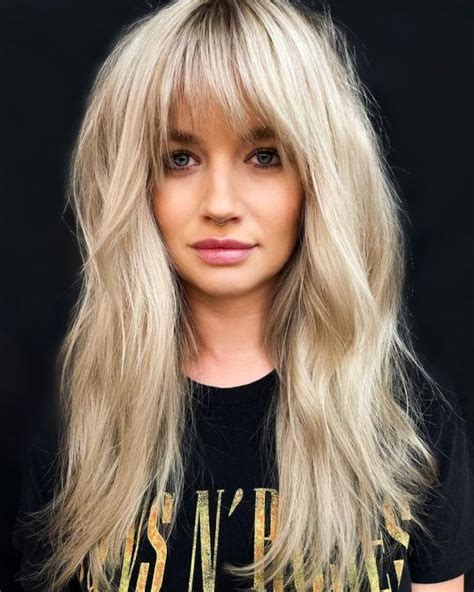 40 hot wispy bangs that are so trendy in 2022 hair adviser long hair with bangs blonde hair