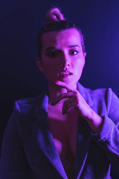 Premium Photo Portrait Of A Sexy Caucasian Woman Posing In Pink Lighting