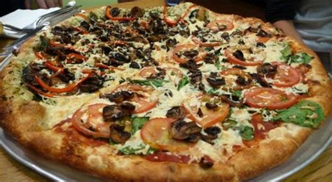 Large Vegan Pizza With Daiya Cheese Half Pesto Field Roast Sausage Peppers Mushrooms And