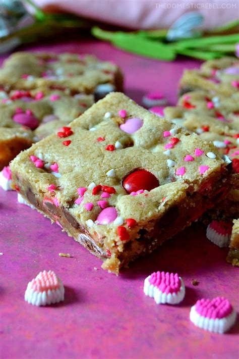 Line baking sheets with silicone baking mats or parchment paper, set aside. Valentine's M&M Cookie Bars | The Domestic Rebel