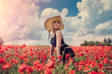 premium photo beautiful woman in a poppy field enjoy summer time