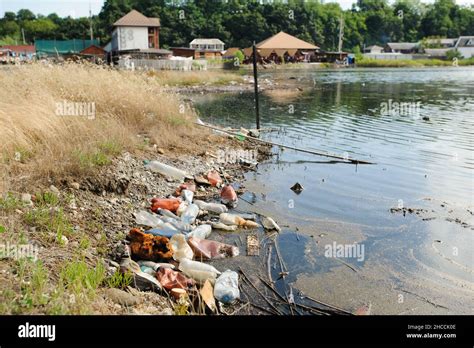 The Lake And The Shore Are Littered With The Garbage Stock Photo Alamy