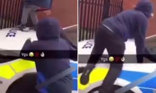 School Children Jump On A Police Car In Birmingham