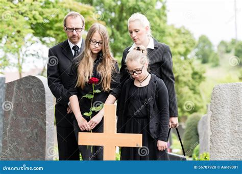 Family Mourning On Funeral At Cemetery Royalty-Free Stock Image