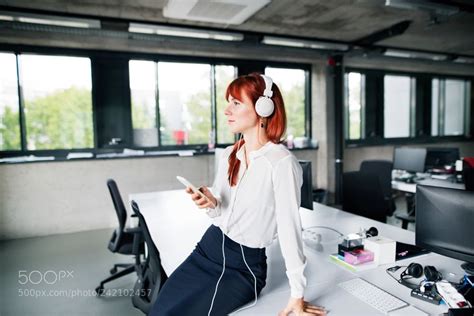 Businesswoman With Earphones And Smartphone Business Women Earphone