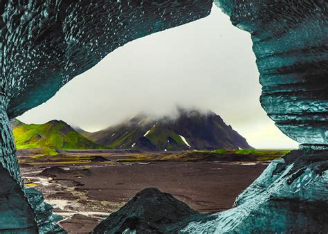 A View Of Iceland Seen From Inside A Melting Ice Cave