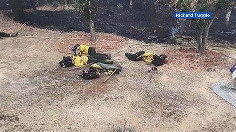 Video Valiant Firefighters Get Brief Rest In Neighbors Yard During