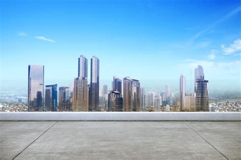 Premium Photo Rooftop View With Modern Cityscapes And Blue Sky Background