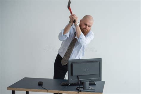 Stressed Crazy Businessman Smashing His Computer In Office Using Ax Problem Concept The Man Has