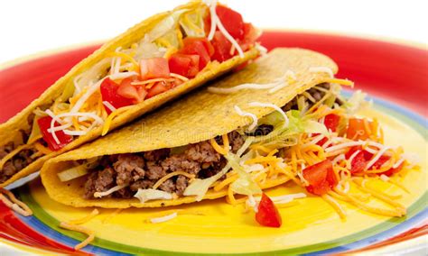 Two Tacos On A Plate On A White Background Royalty Free Stock Photos
