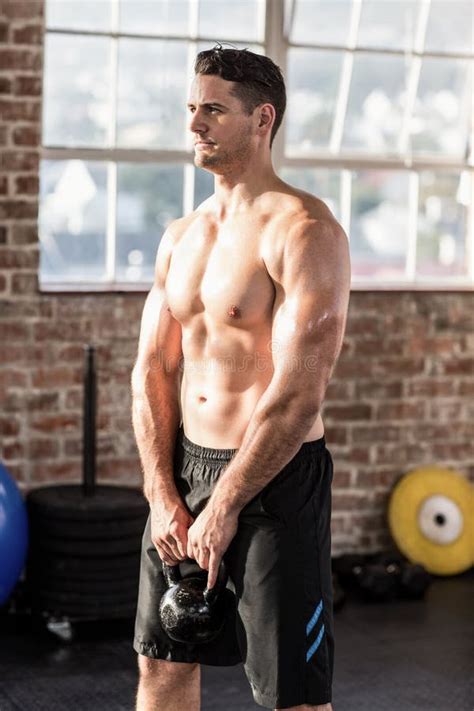 Muscular Man Lifting A Kettlebell Stock Photo Image Of Exercise