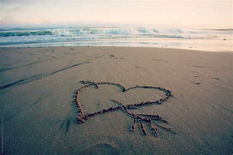 Heart Drawn On The Sand At The Beach By Stocksy Contributor Carolyn Lagattuta Stocksy