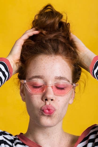Free Photo Close Up Pretty Woman With Kissy Face And Glasses