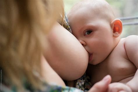 Mother Breast Feeding Baby By Stocksy Contributor Jamie Grill Atlas