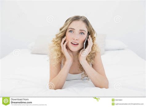 Pretty Thoughtful Blonde Lying On Bed Phoning Stock Image Image Of