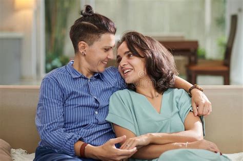 Married Lesbian Couple Sitting On Sofa Stock Image Image Of