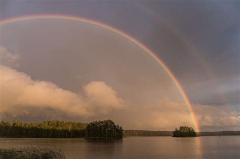 Premium Photo Double Rainbow Over Lake In Finland