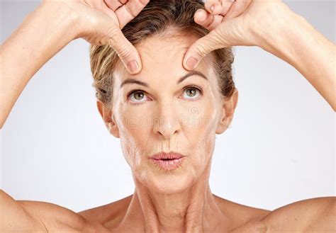 Senior Woman Beauty Portrait And Face Lift On Gray Studio Background Wellness Skincare Model