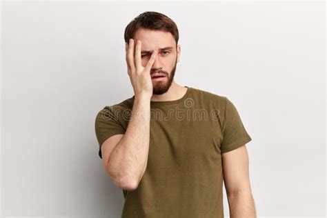 Young Handsome Dissapointed Unhappy Depressed Man With A Hand On His
