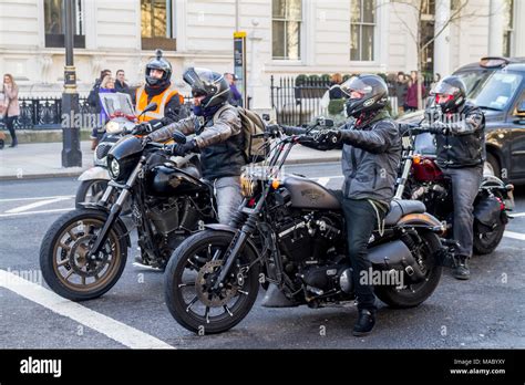 Group Of Bikers Riding Harley Davidson Bikes London Uk Stock Photo