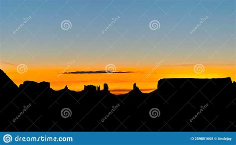 Sunrise Silhouettes Monument Valley Stock Photo Image Of Desert