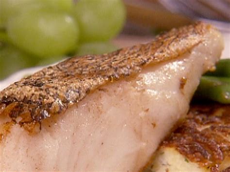 Make a thick coating on the fillets and drop them into hot oil in a deep fat fryer. Pan Fried Sea Bass Recipe | Danny Boome | Food Network