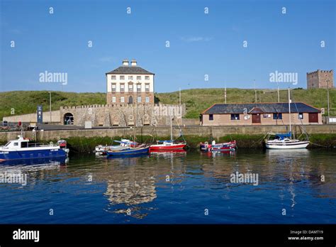 Eyemouth Harbour In East Lothian Scotland With Gunsgreen House And