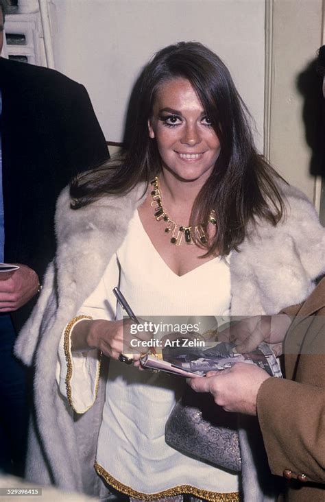 Natlaie Wood Signing Autographs Wearing A White Fur Coat Circa 1970