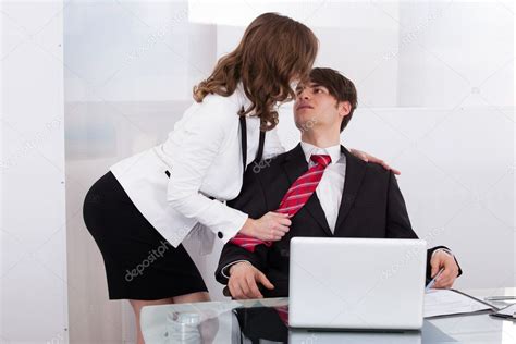 Sensuous Secretary Seducing Boss At Desk Stock Photo Image By AndreyPopov