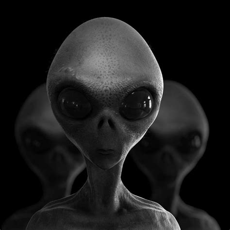 an alien is staring at the camera in black and white with three other aliens behind him