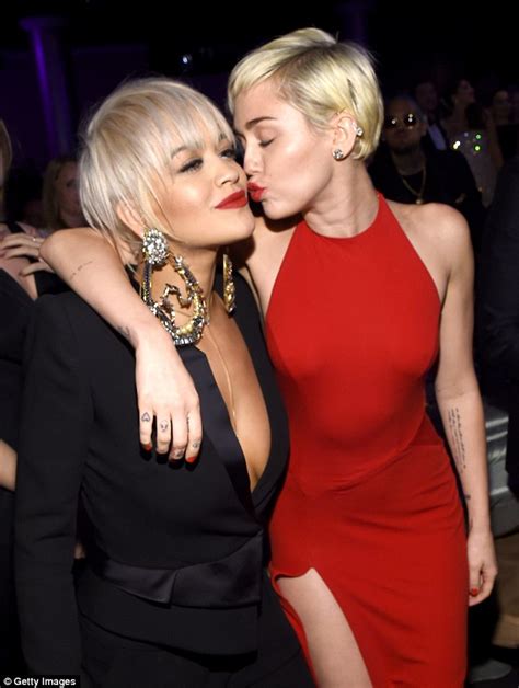 Miley Cyrus Puckers Up For A Kiss With Rita Ora At Pre Grammys Bash