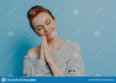 Happy Calm Redhead Grateful Woman Holding Hands In Prayer Gesture With