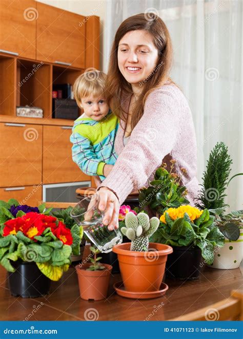 Mother And Baby With Flowering Plants Stock Image Image Of Happy