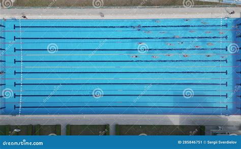 From Above You Can See A Group Of Swimmers Training In A Sports Pool