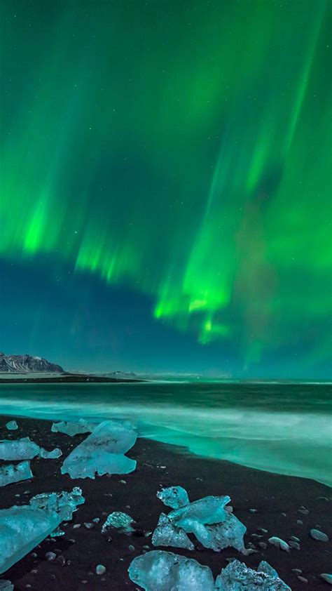 Green Aurora Borealis Over The Ocean Wallpaper Download 720x1280