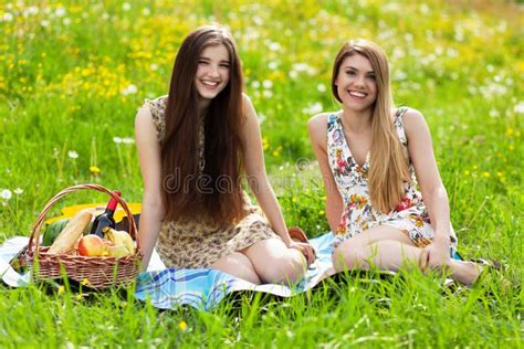 Two Beautiful Young Women On A Picnic Stock Image Image Of Grass