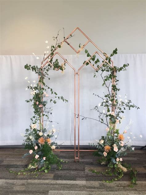Copper Arch In Cathedral Window Shape Perfect For An Outdoor Wedding