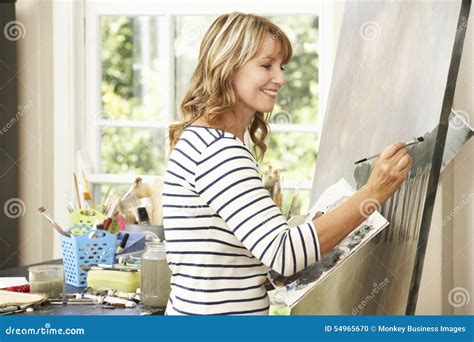 Female Artist Working On Painting In Studio Stock Photo Image Of